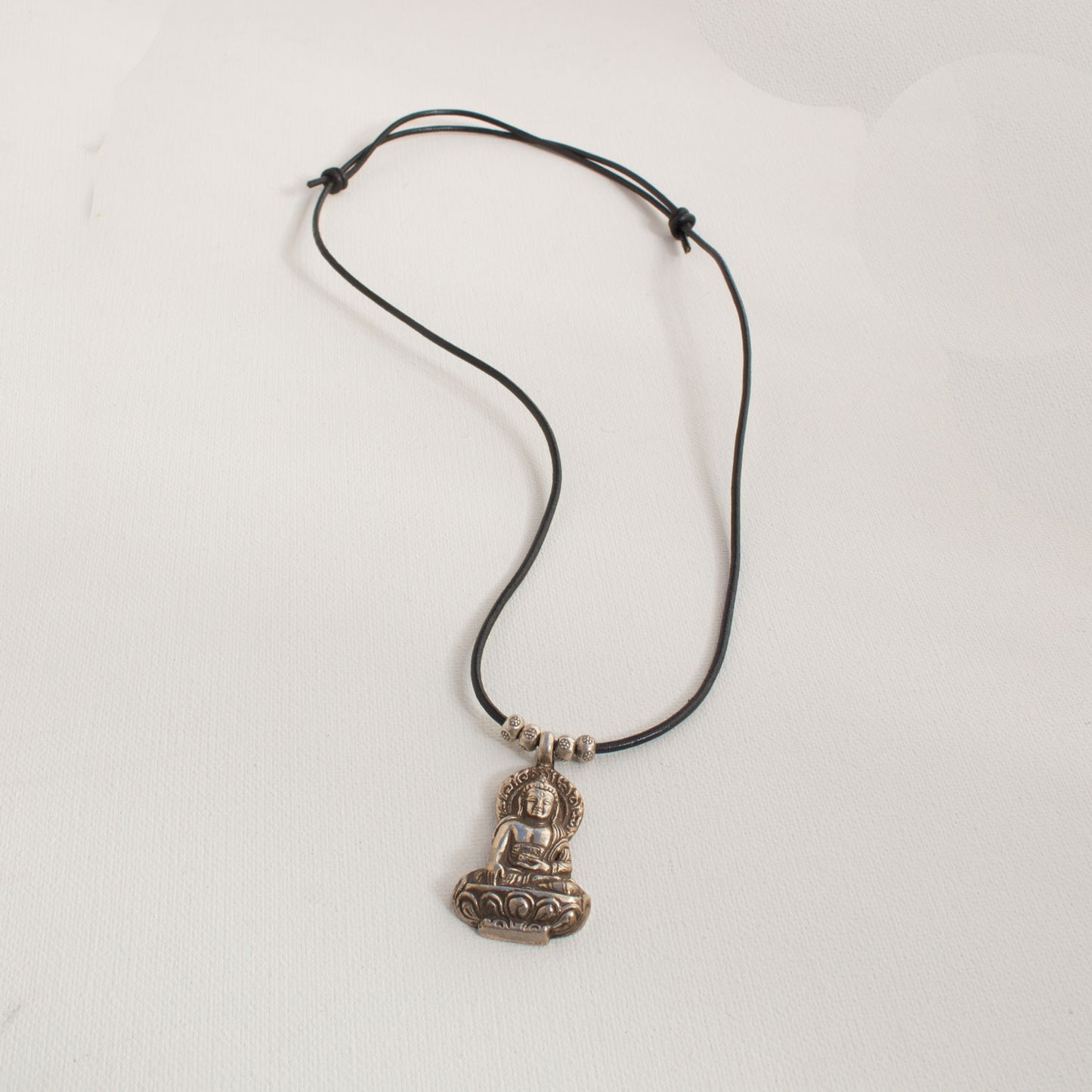 Silver Buddha pendant On Black Adjustable Leather Cord