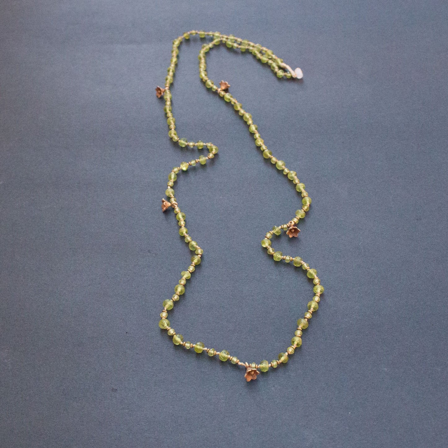 Faceted Peridot On Silk Cord Necklace