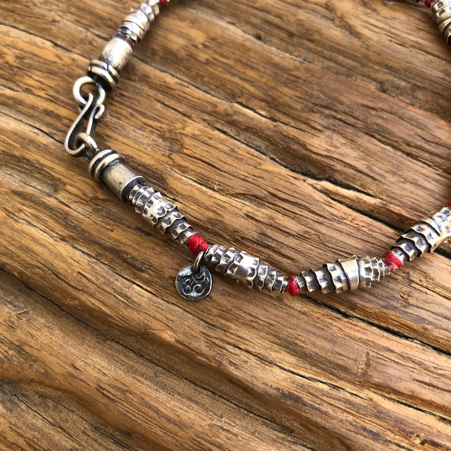 Knotted Silver Bead On Red Cord Bracelet