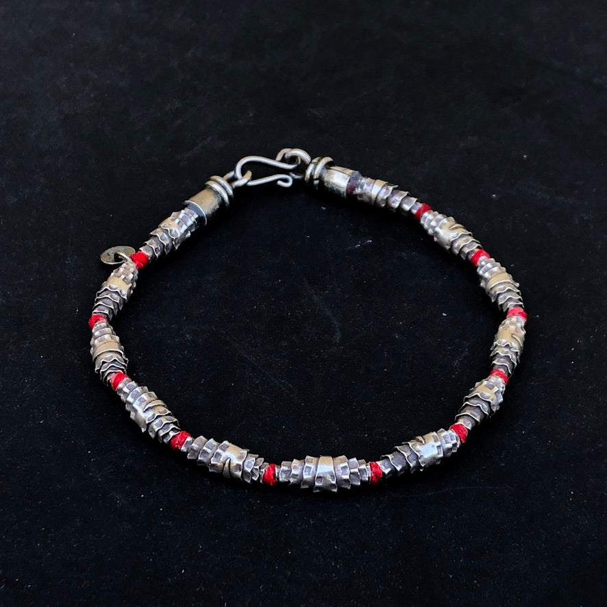 Knotted Silver Bead On Red Cord Bracelet