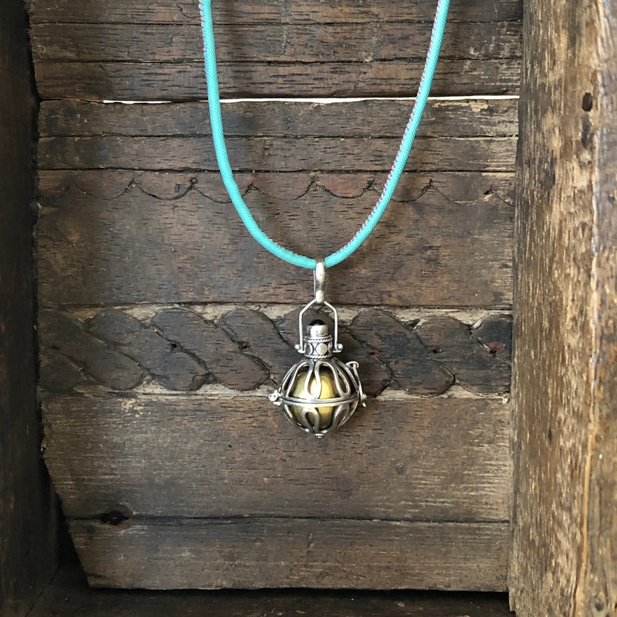 Harmony Ball Pendant On Blue Necklace