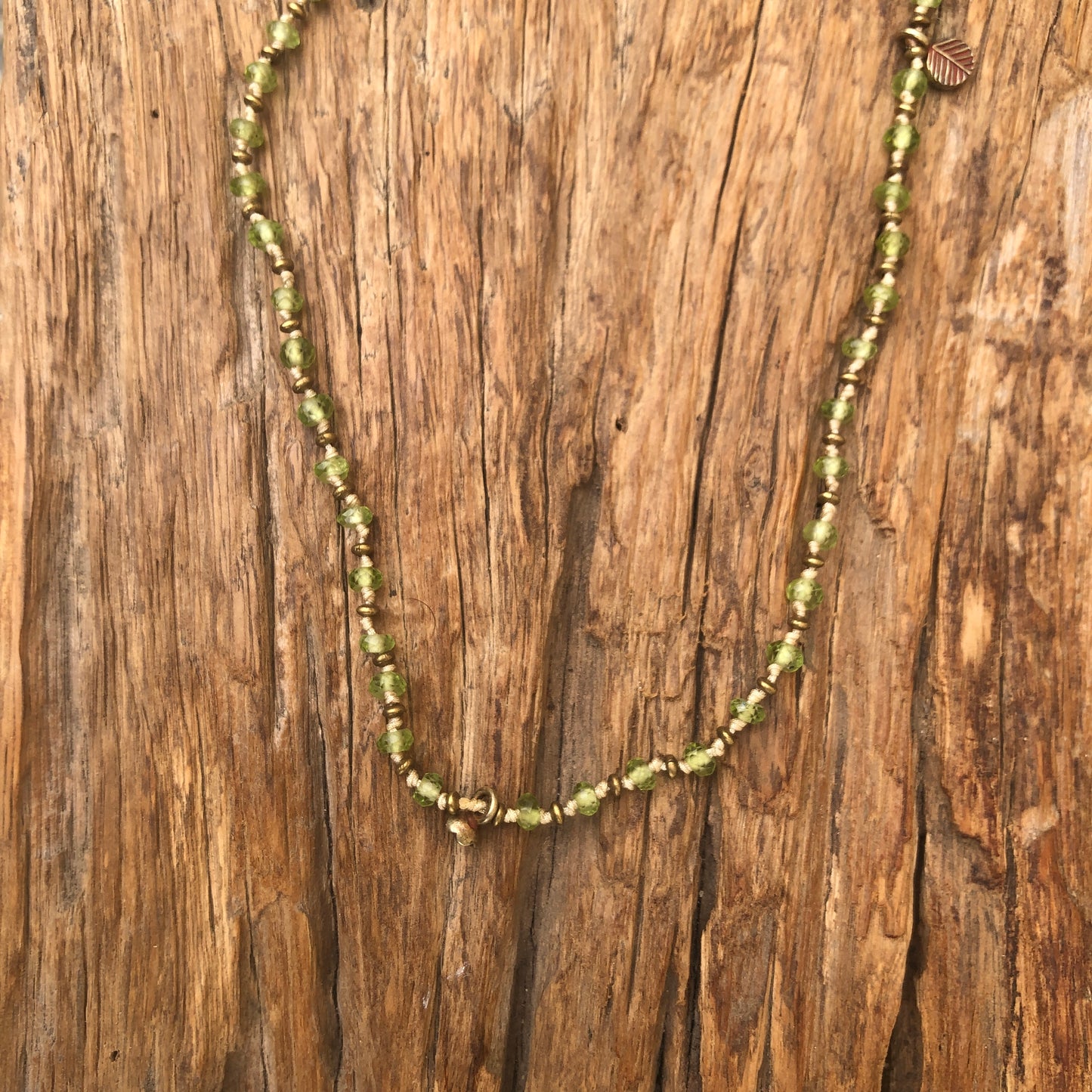 Faceted Peridot On Silk Cord Necklace