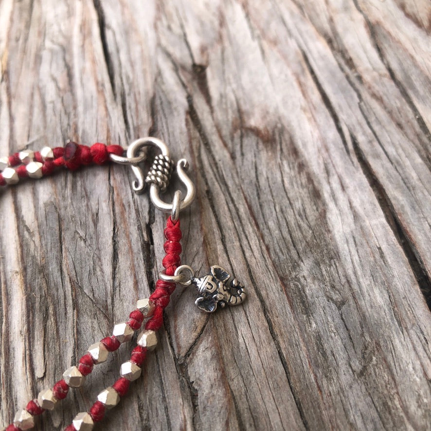 Knotted Silver Cubes Ganesha On Red Cord Bracelet