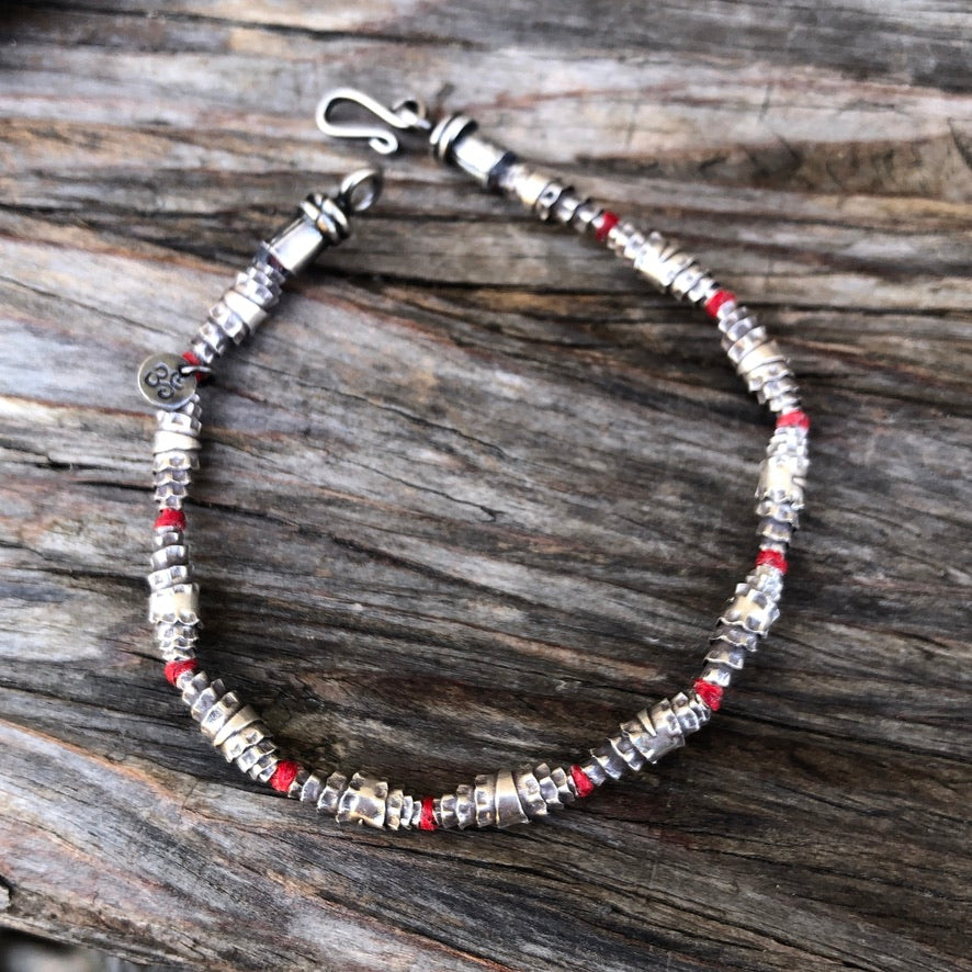 Knotted Silver Bead On Red Cord Bracelet