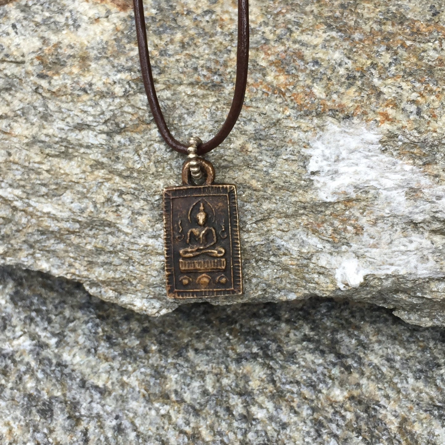 Seated Buddha Amulet On Leather Cord