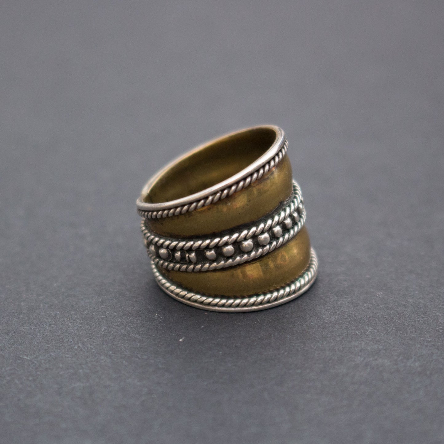 Silver and brass ring